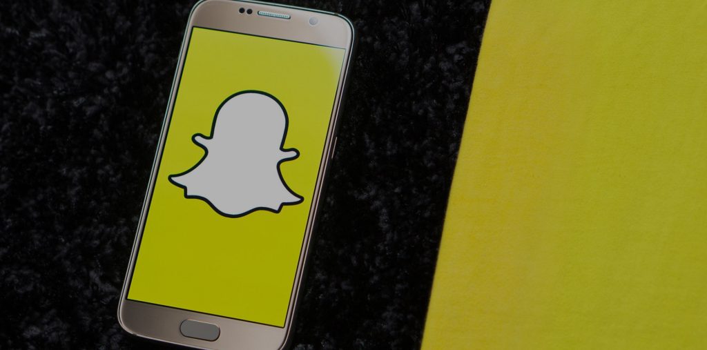 Snapchat's 2024 app redesign featuring a simplified interface with three main tabs